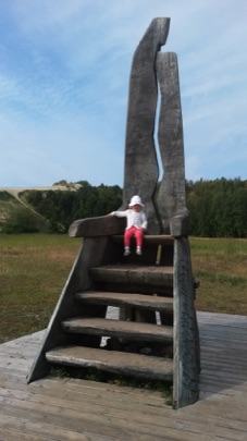 Isla on a really big chair